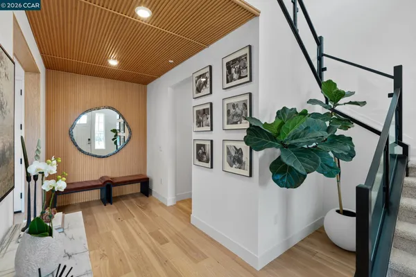 a view of a hallway with seating space