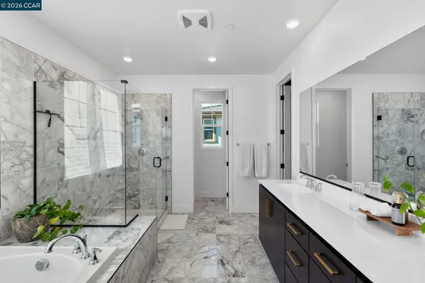 a bed room with a bed and a potted plant