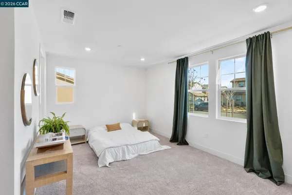 a bathroom with a granite countertop sink toilet a mirror and shower