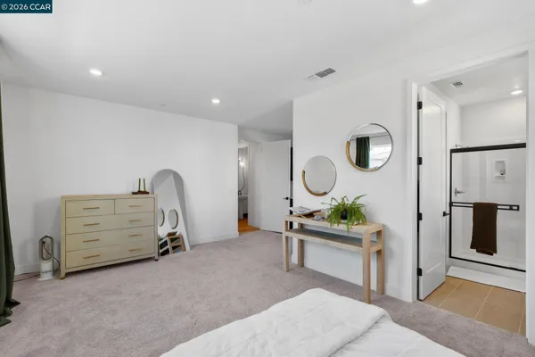a bathroom with a shower and a glass door