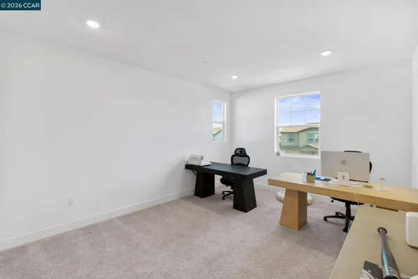 a white toilet sitting next to a window