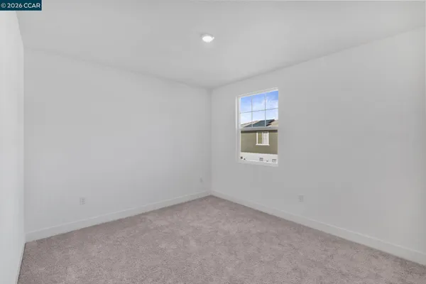 a bathroom with double sink and a mirror