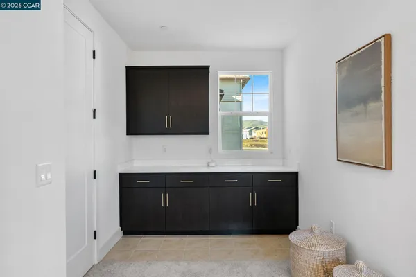 a view of a swimming pool with a patio and plants