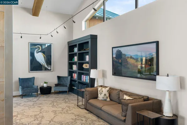 a view of a kitchen with a sink and a large window
