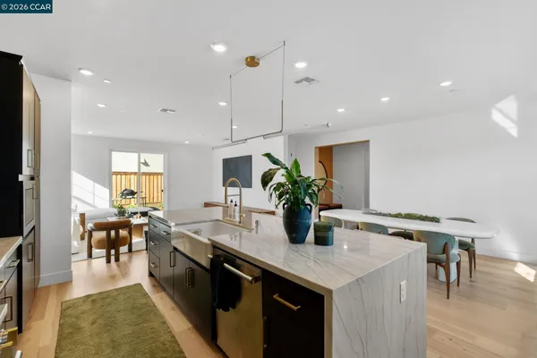 a kitchen with a refrigerator and a sink