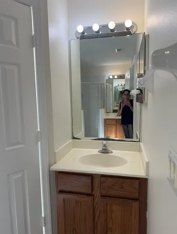 a bathroom with a sink and a mirror