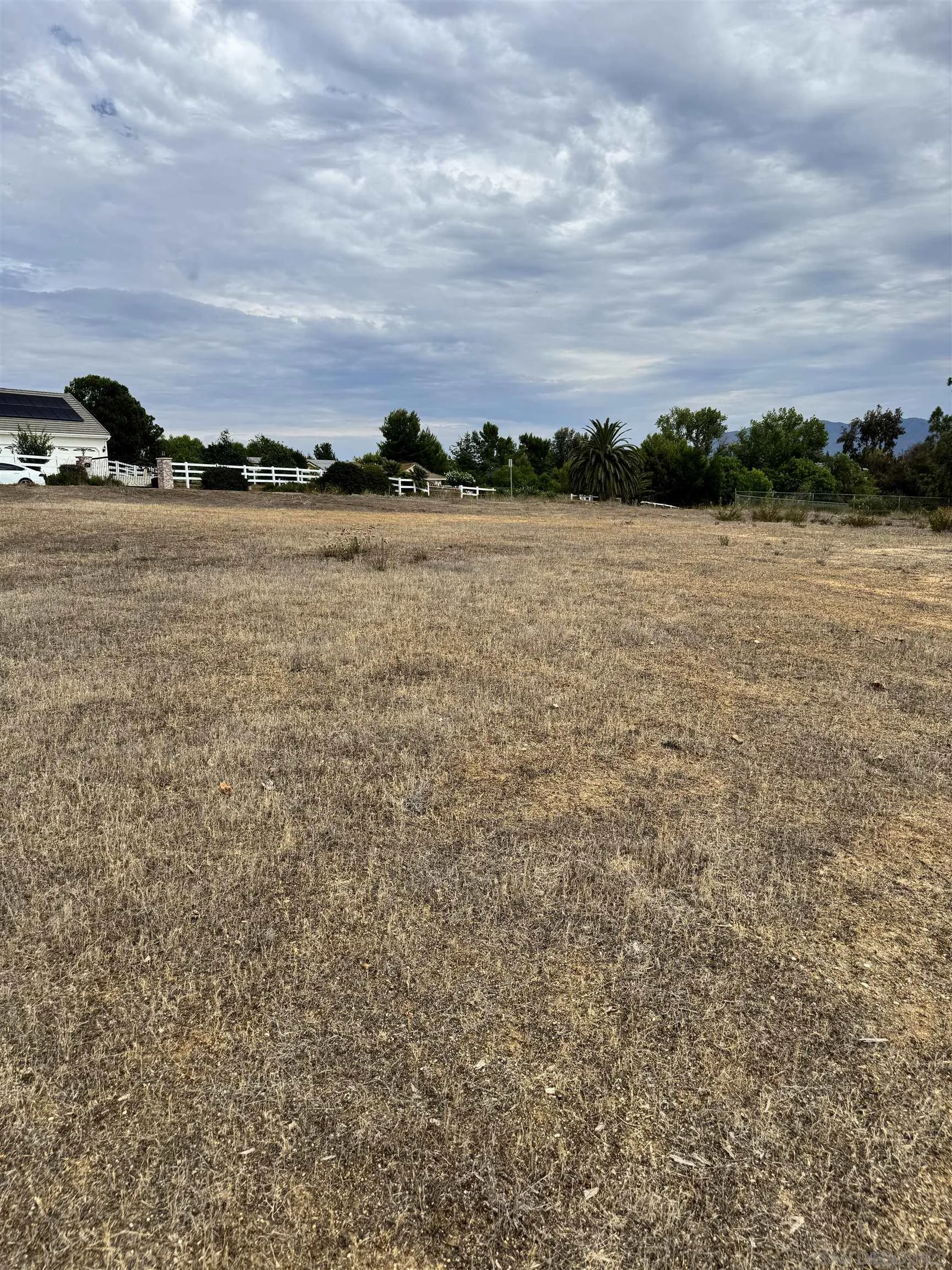 0 Green Tree Road, Unit 178 Temecula, CA 92592 - Photo 4 of 5 a view of a lake with houses in the back