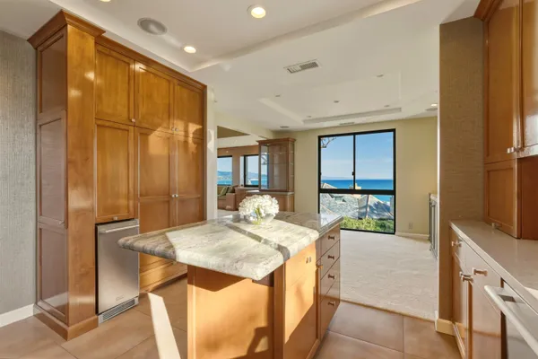 an empty room with a ceiling fan and a window