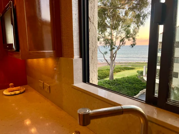 a view of an empty room with glass door