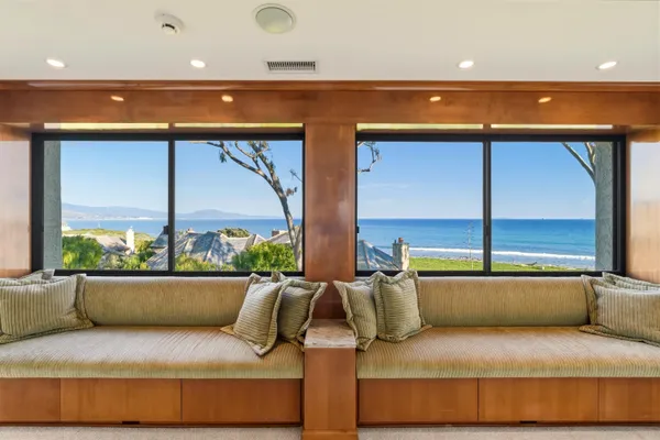 a kitchen with a sink and large window