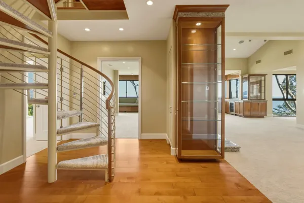 a kitchen with stainless steel appliances granite countertop a sink a stove and a refrigerator