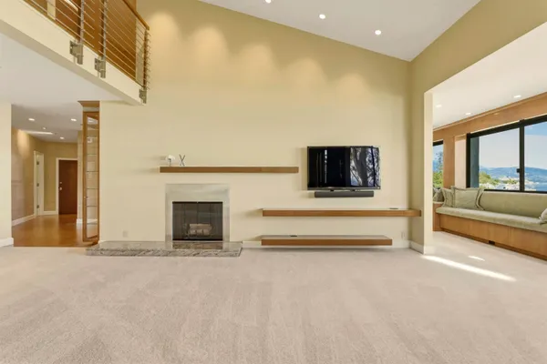 a spacious bedroom with a bed and a dresser