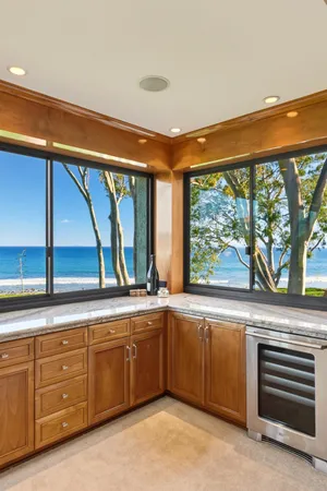 a spacious bathroom with a double vanity sink a mirror and a shower