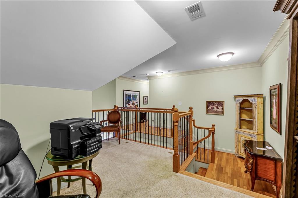 5909 Ballinger Road, Unit A Greensboro, NC 27410 - Photo 23 of 41 Loft area at top of stairs taht overlooks the main level Great Room