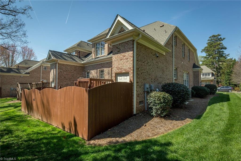 5909 Ballinger Road, Unit A Greensboro, NC 27410 - Photo 38 of 41 5909 #A backview with fenced deck