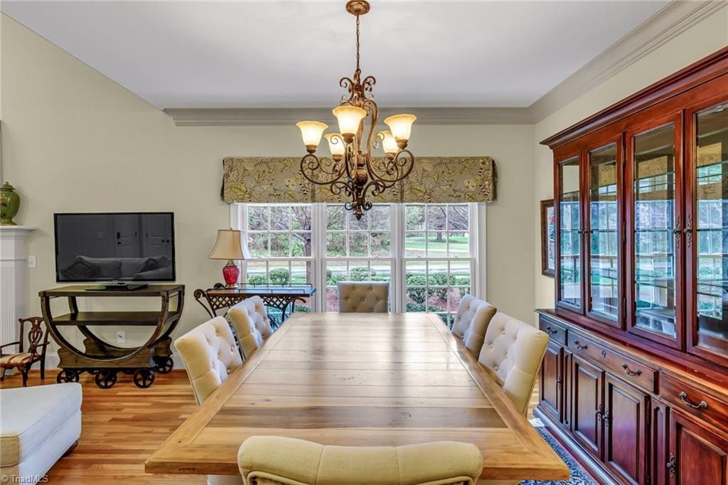 5909 Ballinger Road, Unit A Greensboro, NC 27410 - Photo 9 of 41 Dining Room with view out side of house through triple window.