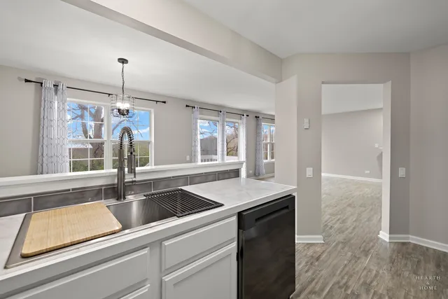 a kitchen with a sink and a window