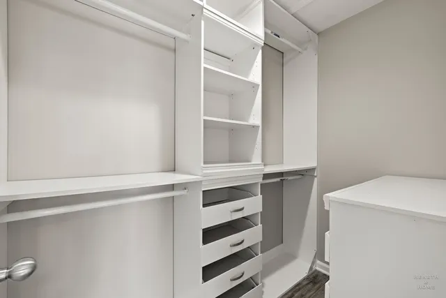 a view of an empty walk in closet