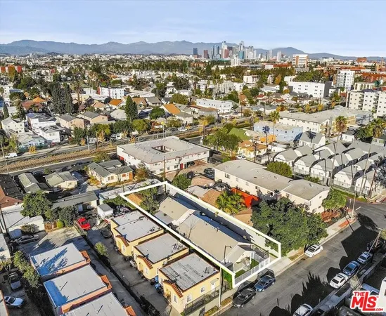 an aerial view of residential building and parking space