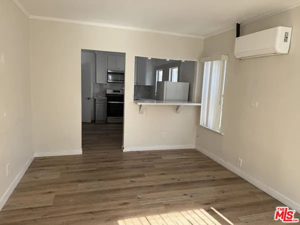 a view of a kitchen cabinets and wooden floor