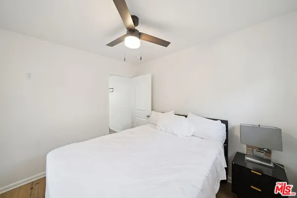 a large white bed in a white room