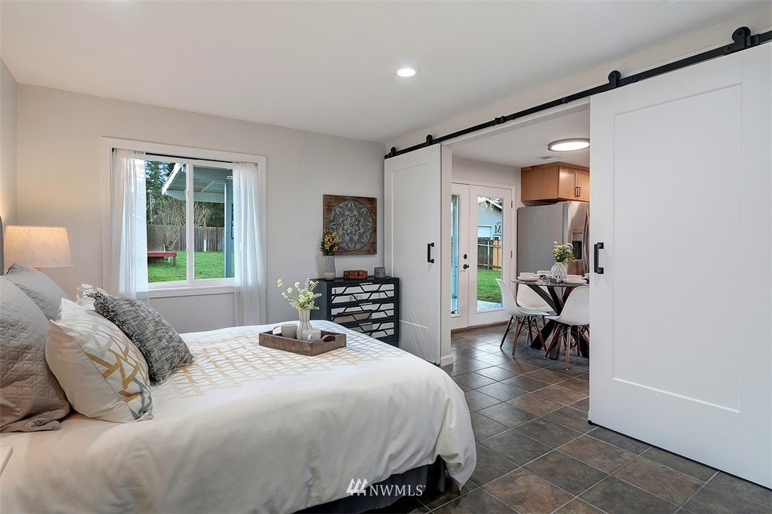 3708 Northeast 22nd Street Renton, WA 98056 - Photo 13 of 20 a bedroom with a bed and a dresser