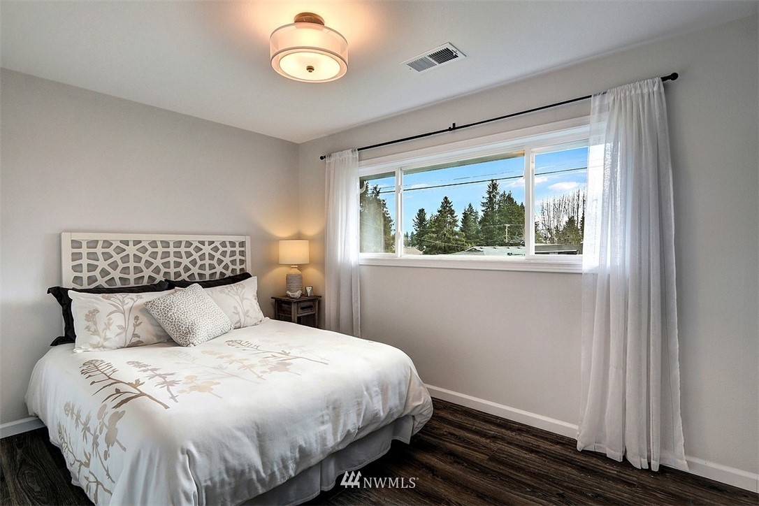 3708 Northeast 22nd Street Renton, WA 98056 - Photo 15 of 20 a bedroom with a large bed and a window