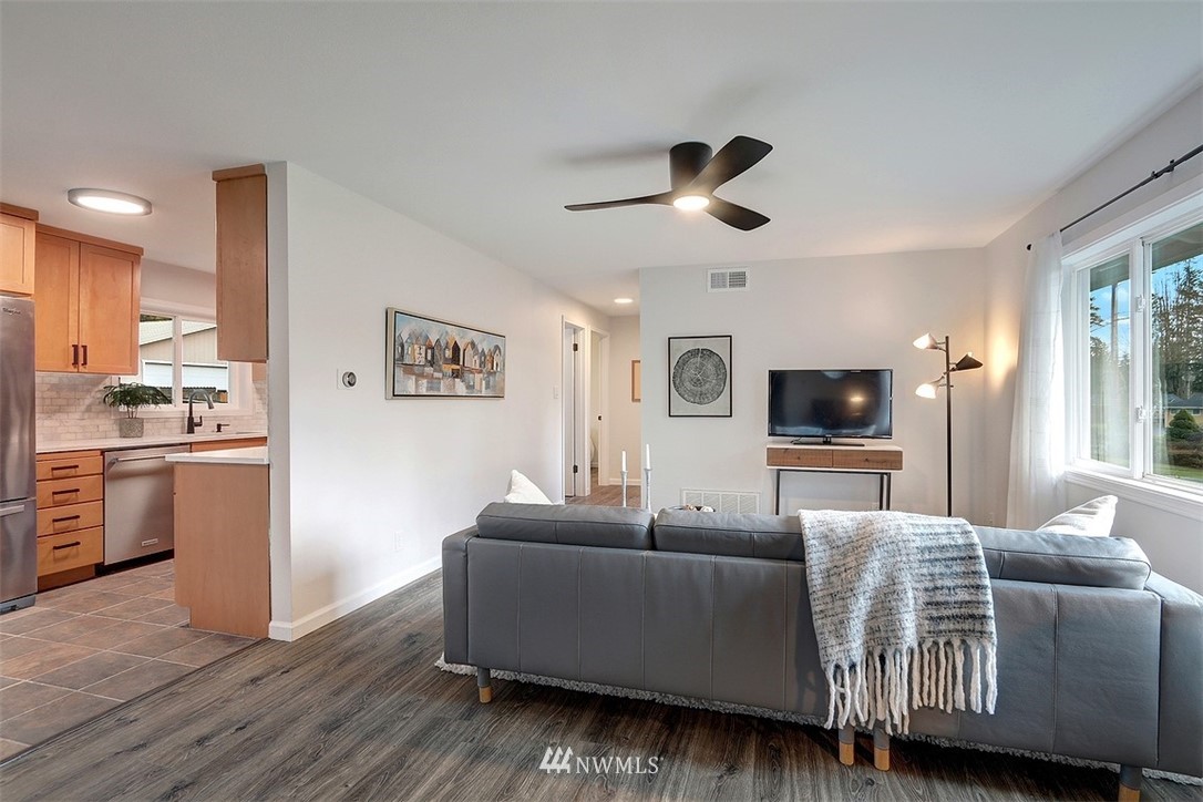 3708 Northeast 22nd Street Renton, WA 98056 - Photo 2 of 20 a living room with furniture and a wooden floor