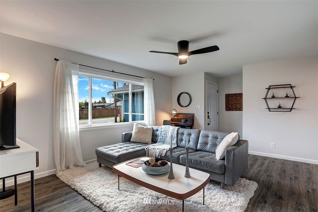3708 Northeast 22nd Street Renton, WA 98056 - Photo 3 of 20 a living room with furniture and a flat screen tv