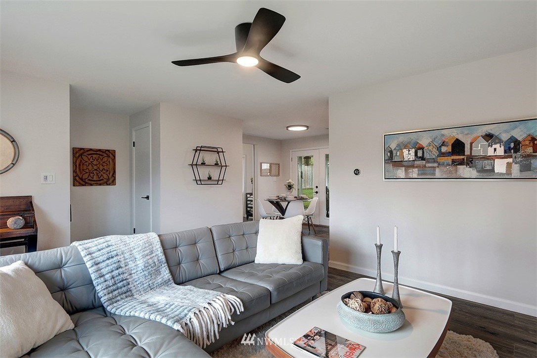 3708 Northeast 22nd Street Renton, WA 98056 - Photo 4 of 20 a living room with furniture and a wooden floor