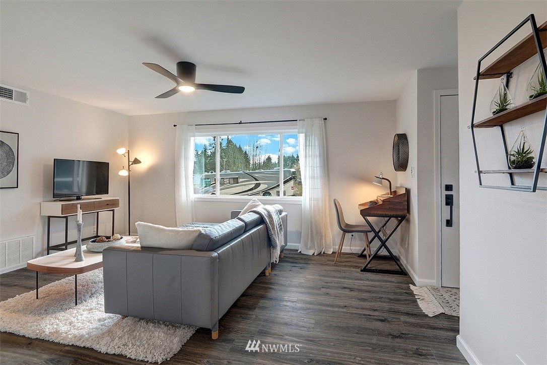 3708 Northeast 22nd Street Renton, WA 98056 - Photo 5 of 20 a living room with furniture and a flat screen tv