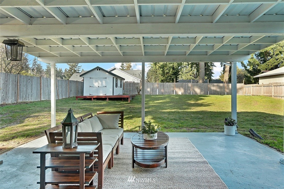 3708 Northeast 22nd Street Renton, WA 98056 - Photo 9 of 20 a view of a patio with a table chairs and a swimming pool