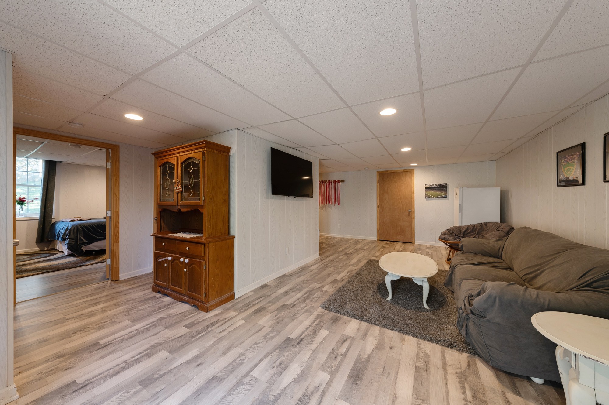 7524 Cherokee Hills Road Fairview, TN 37062 - Photo 22 of 30 a living room with furniture and a flat screen tv