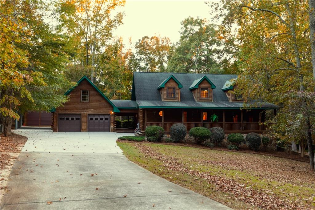 435 Rosser Road Covington, GA 30016 - Photo 1 of 1 a front view of house with yard and trees in the background