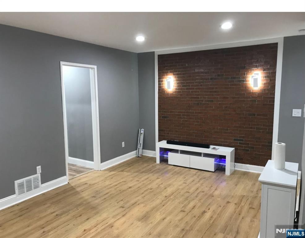 448 River Road Nutley, NJ 07110 - Photo 11 of 11 a view of an empty room with wooden floor