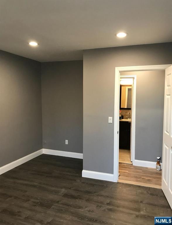 448 River Road Nutley, NJ 07110 - Photo 8 of 11 a view of an empty room with wooden floor and closet