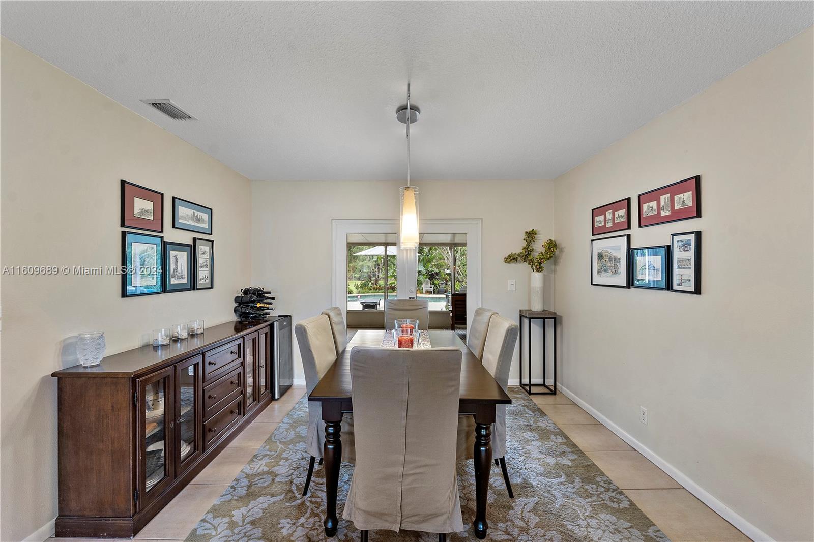 5511 Southwest 196th Lane Southwest Ranches, FL 33332 - Photo 11 of 94 a dining room with wooden floor and windows
