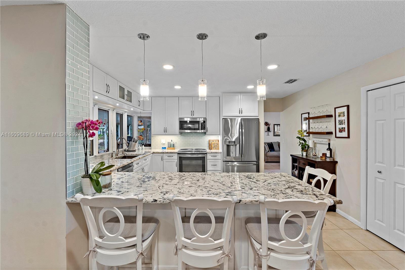 5511 Southwest 196th Lane Southwest Ranches, FL 33332 - Photo 14 of 94 a kitchen that has a table and chairs in it