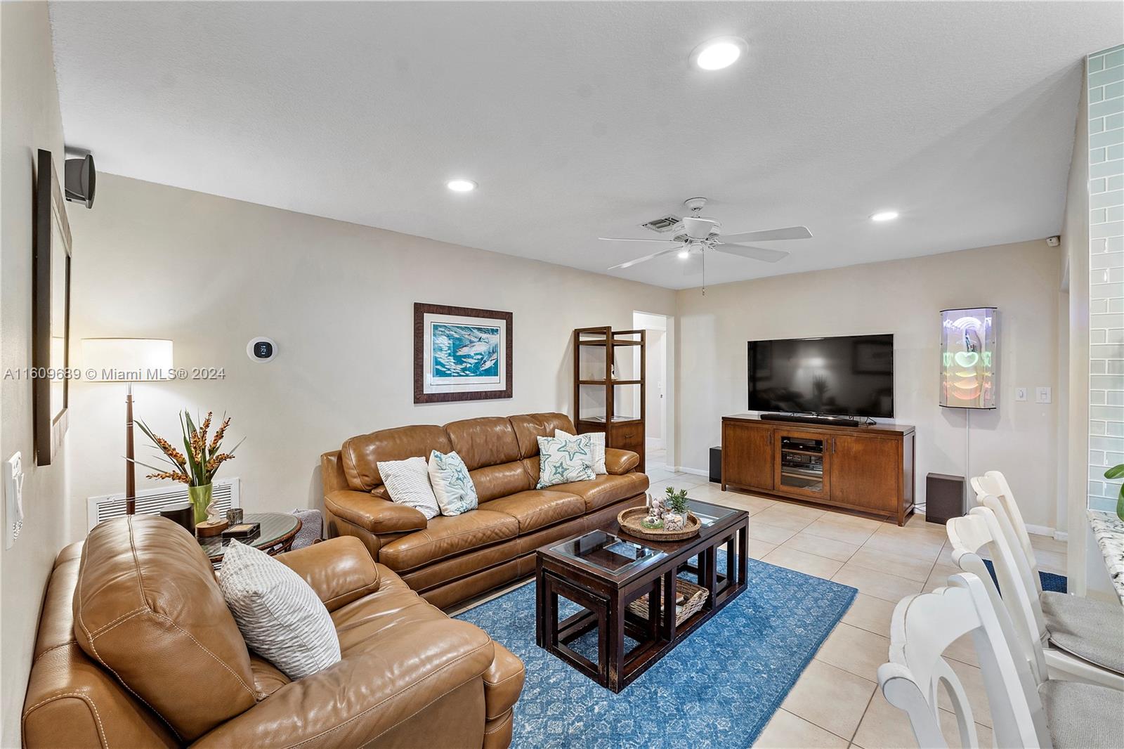 5511 Southwest 196th Lane Southwest Ranches, FL 33332 - Photo 17 of 94 a living room with furniture and a flat screen tv