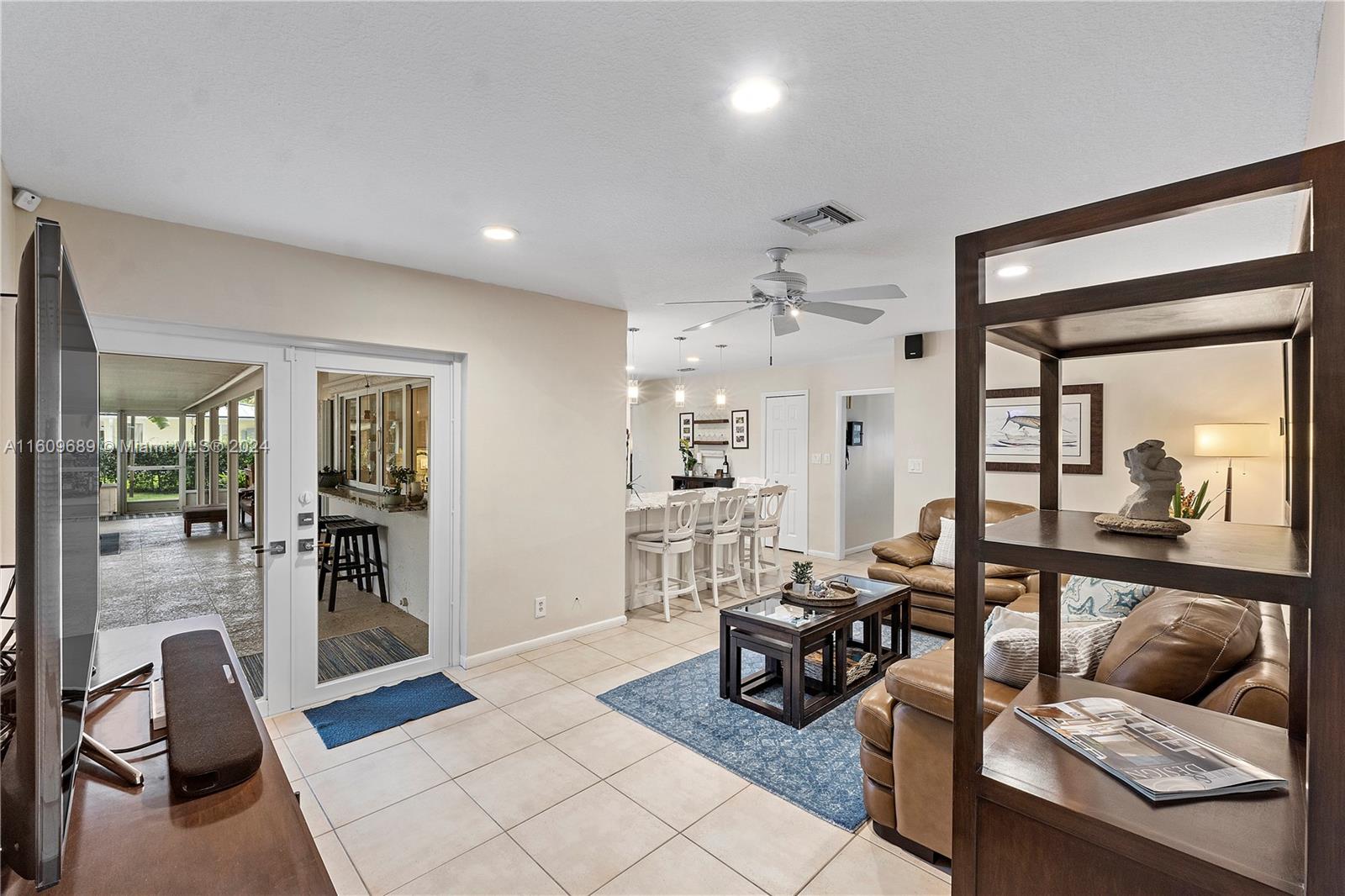 5511 Southwest 196th Lane Southwest Ranches, FL 33332 - Photo 18 of 94 a living room with furniture and a large window