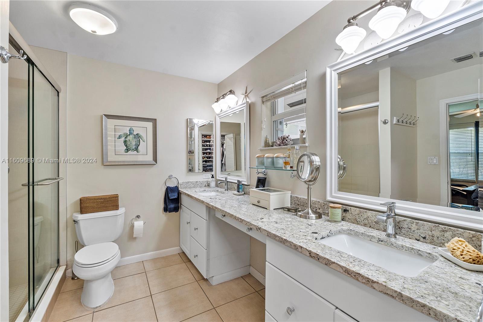 5511 Southwest 196th Lane Southwest Ranches, FL 33332 - Photo 24 of 94 a bathroom with a granite countertop sink mirror vanity and toilet