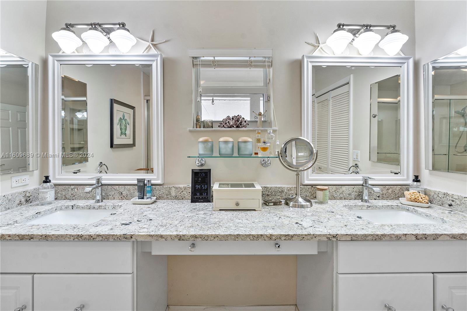 5511 Southwest 196th Lane Southwest Ranches, FL 33332 - Photo 26 of 94 a bathroom with a granite countertop sink and a mirror