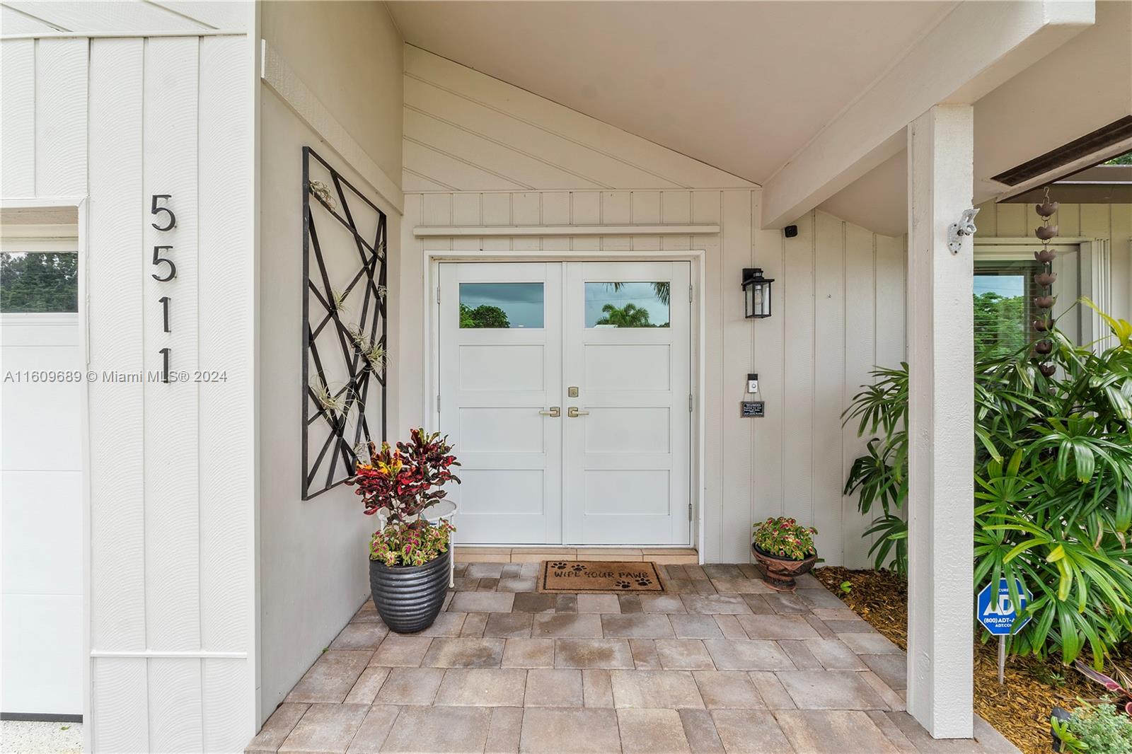 5511 Southwest 196th Lane Southwest Ranches, FL 33332 - Photo 4 of 94 a view of a entryway door front of house
