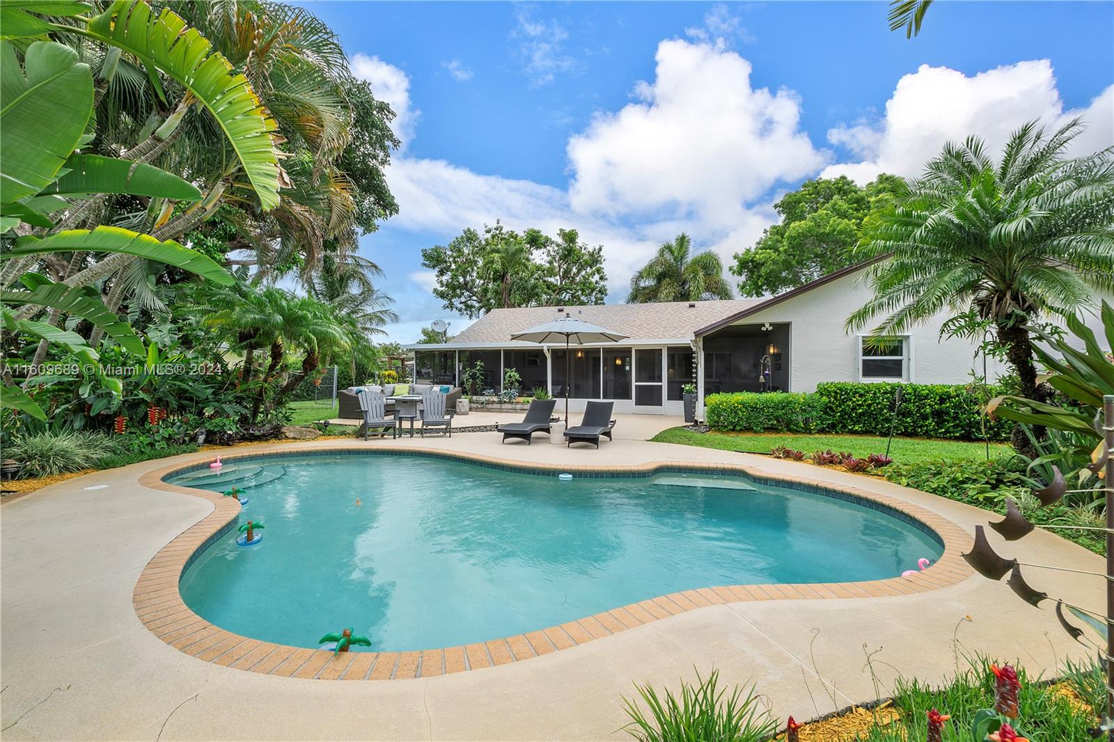 5511 Southwest 196th Lane Southwest Ranches, FL 33332 - Photo 47 of 94 a view of a house with swimming pool and sitting area
