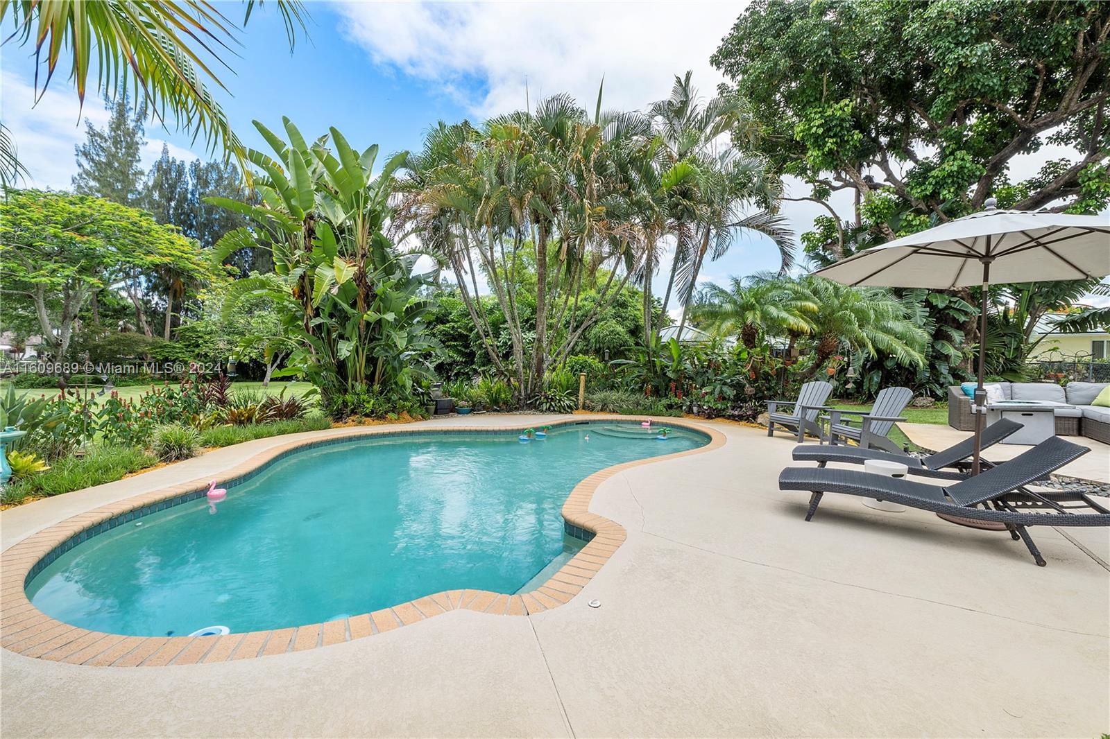 5511 Southwest 196th Lane Southwest Ranches, FL 33332 - Photo 48 of 94 a view of a swimming pool and lounge chair
