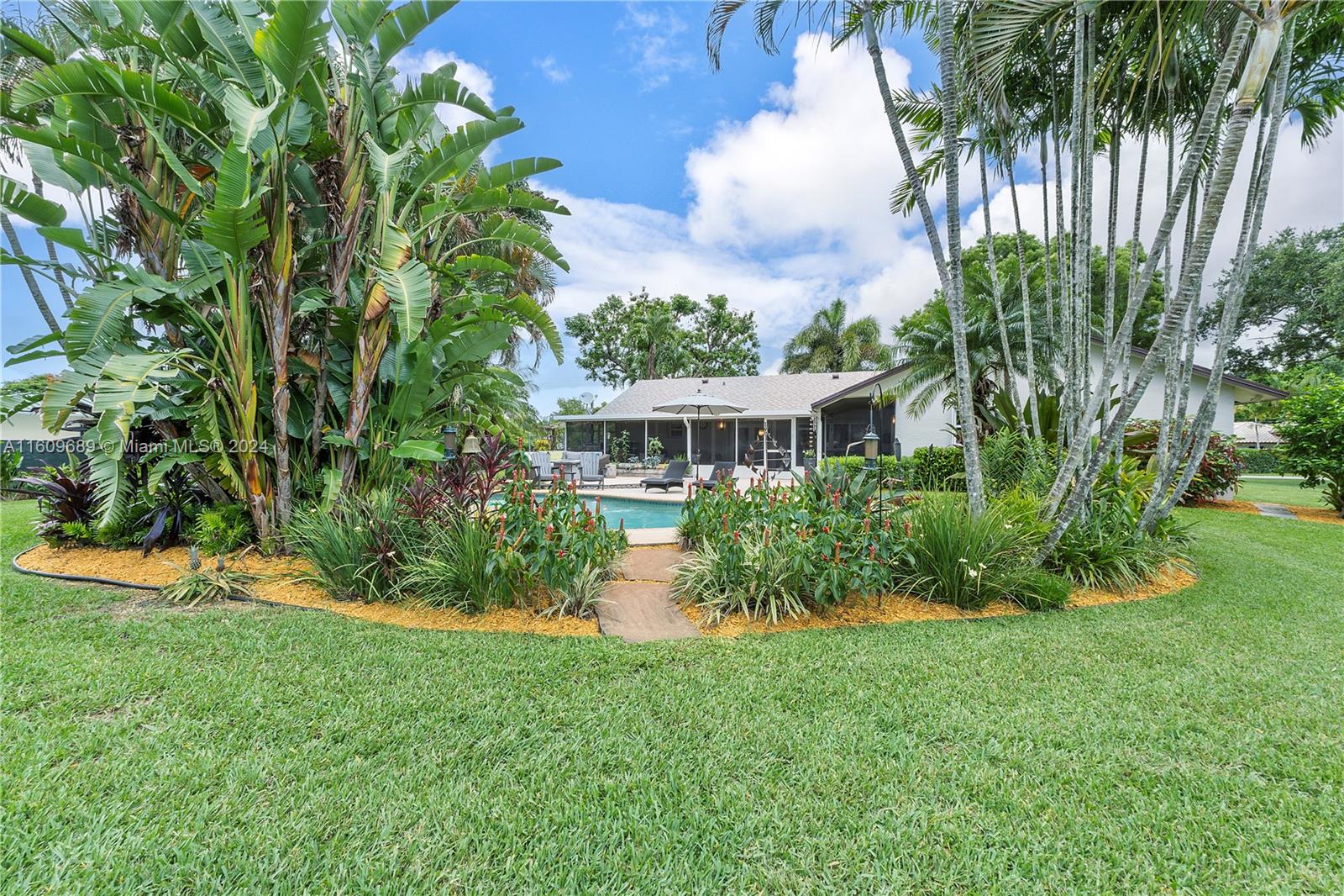 5511 Southwest 196th Lane Southwest Ranches, FL 33332 - Photo 52 of 94 a view of house with yard and entertaining space