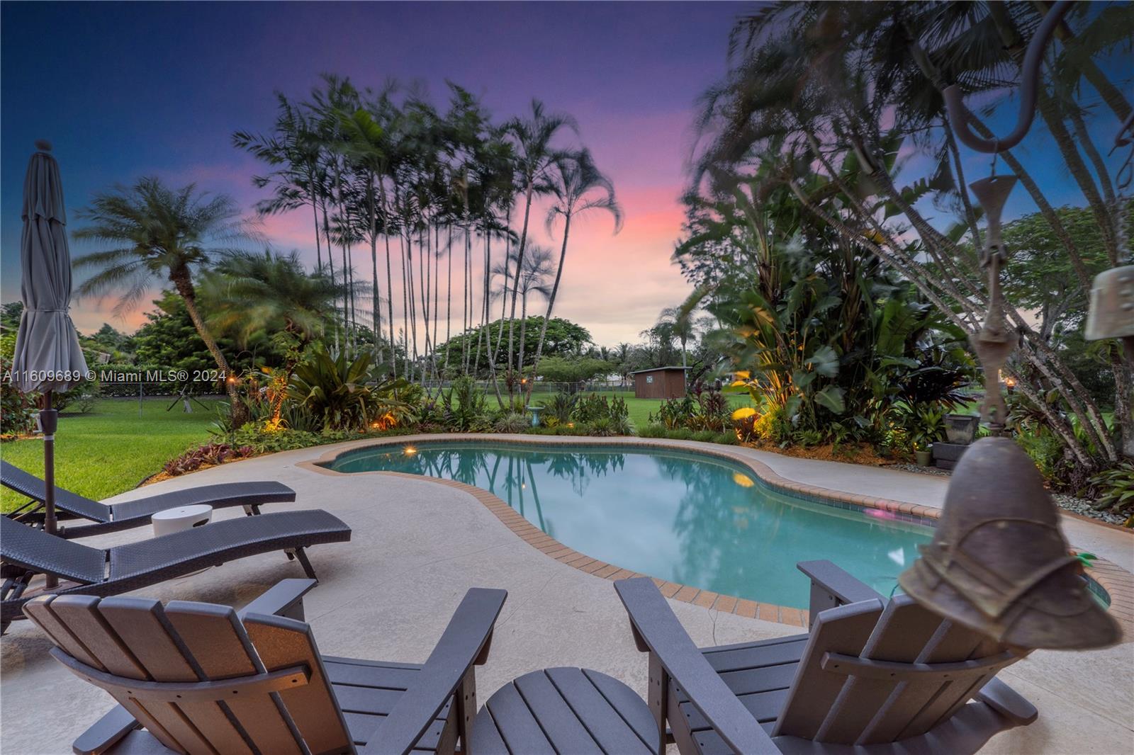 5511 Southwest 196th Lane Southwest Ranches, FL 33332 - Photo 66 of 94 a view of a chairs and table in patio with swimming pool