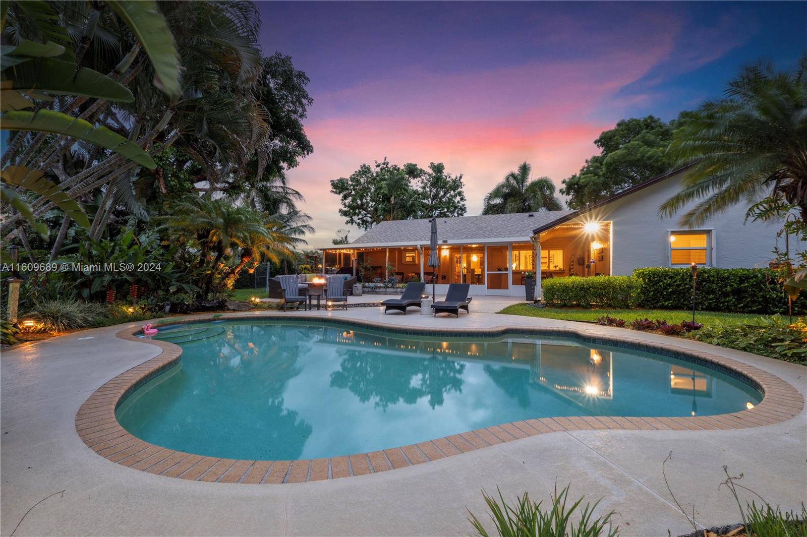 5511 Southwest 196th Lane Southwest Ranches, FL 33332 - Photo 67 of 94 a view of a house with swimming pool and sitting area