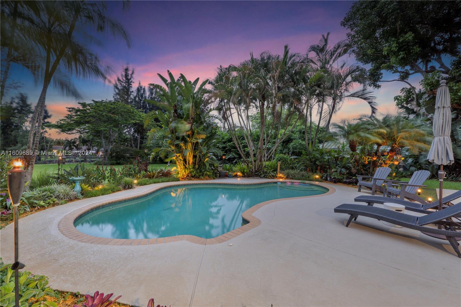 5511 Southwest 196th Lane Southwest Ranches, FL 33332 - Photo 69 of 94 a view of a swimming pool and lounge chair