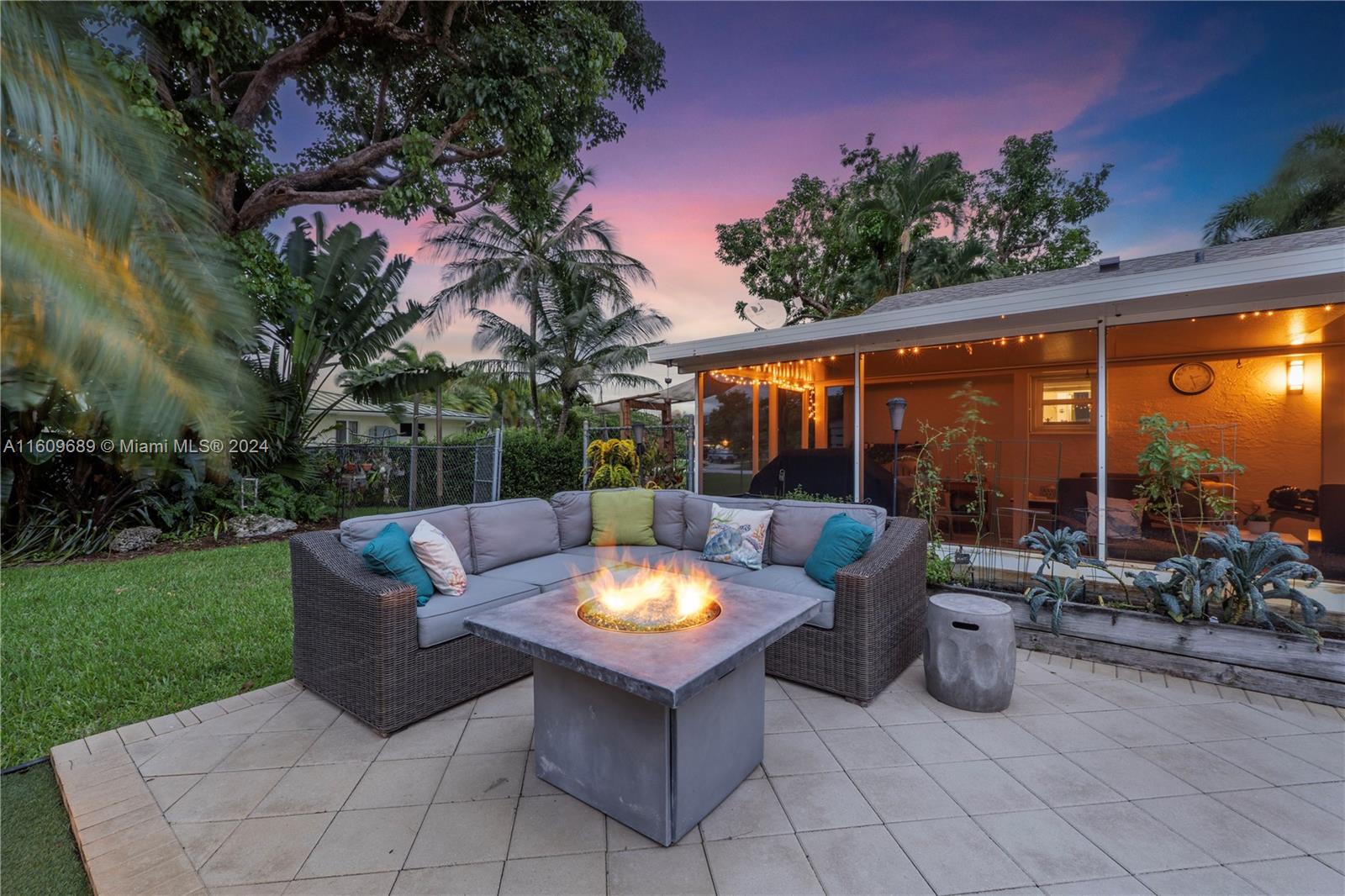5511 Southwest 196th Lane Southwest Ranches, FL 33332 - Photo 70 of 94 a view of a patio with couches table and chairs and potted plants